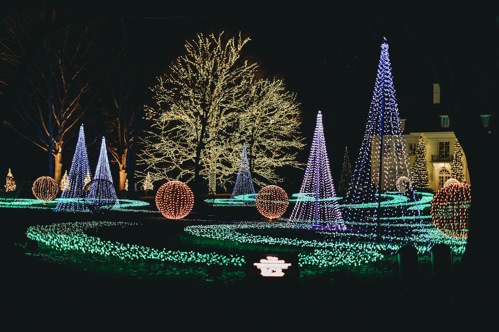a house yard decorated with colorful string lights