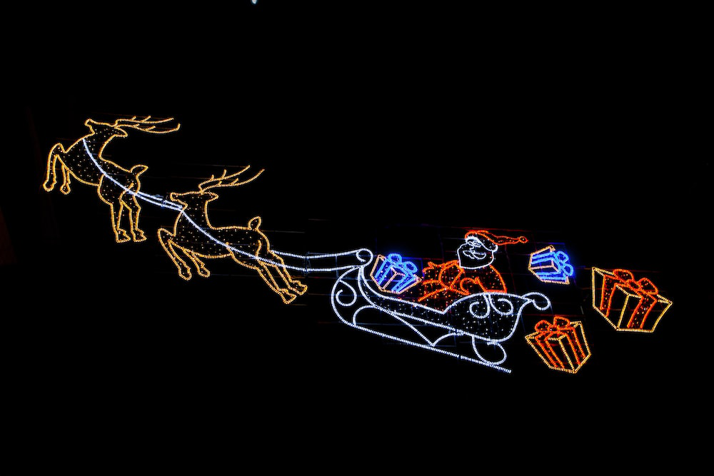 festive lights in the shape of a reindeer pulling a sleigh