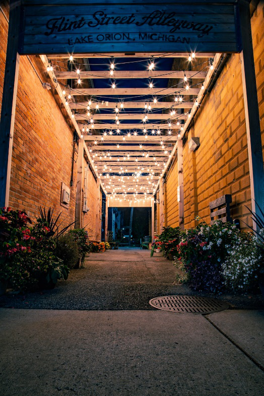 string lights installation in a hallway