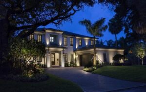 A house exterior with lighting